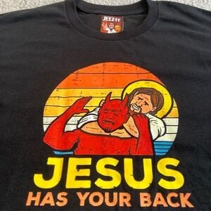 “Jesus Has Your Back” Devil Choke Men’s Black Tee NWT